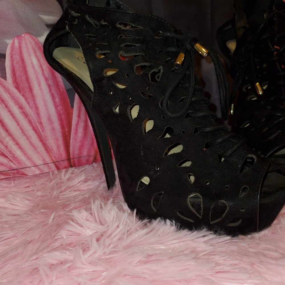 Black suede heels by Dots